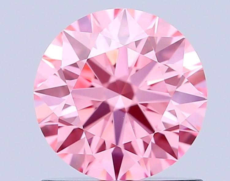 Ideal Loose Diamond - ROUND 0.93ct Fancy Vivid Pink VVS2: Ideal Loose Diamond - ROUND 0.93ct Fancy Vivid Pink VVS2 Source: This is a real non-mined Diamond that has been grown in a lab Shape: ROUND Carats: 0.93 Color: Fancy Vivid Pink Certification: IGI