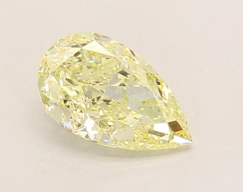 Loose Diamond - PEAR 1.39ct Fancy Light Yellow VVS2: Loose Diamond - PEAR 1.39ct Fancy Light Yellow VVS2 Source: This is a real non-mined Diamond that has been grown in a lab Shape: PEAR Carats: 1.39 Color: Fancy Light Yellow Certification: IGI Video: