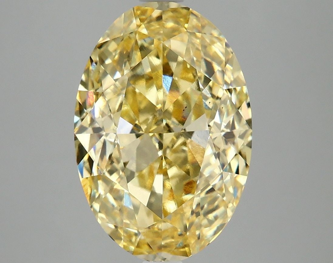 Loose Diamond - OVAL 5.06ct Fancy Vivid Yellow VS2: Loose Diamond - OVAL 5.06ct Fancy Vivid Yellow VS2 Source: This is a real non-mined Diamond that has been grown in a lab Shape: OVAL Carats: 5.06 Color: Fancy Vivid Yellow Certification: IGI Video:
