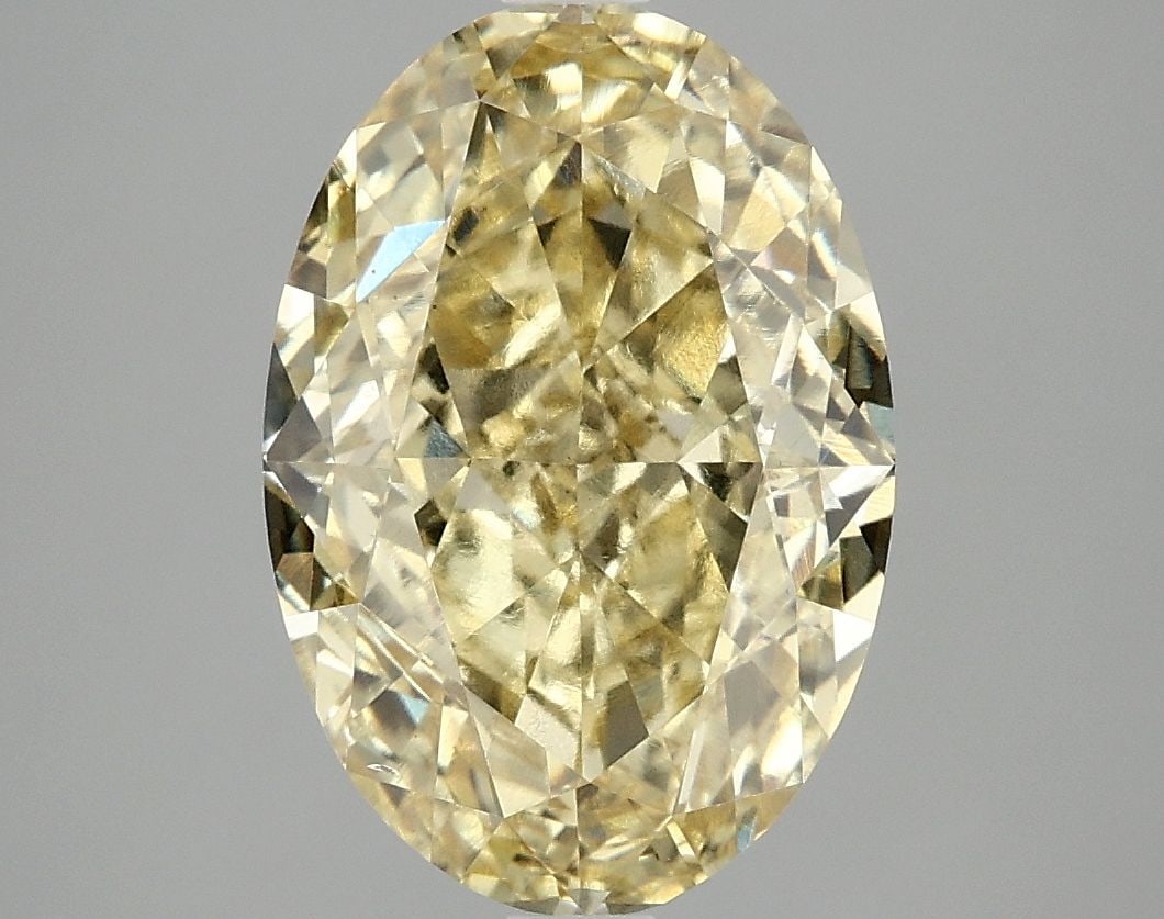 Loose Diamond - OVAL 5.02ct Fancy Vivid Yellow VS2: Loose Diamond - OVAL 5.02ct Fancy Vivid Yellow VS2 Source: This is a real non-mined Diamond that has been grown in a lab Shape: OVAL Carats: 5.02 Color: Fancy Vivid Yellow Certification: IGI Video: