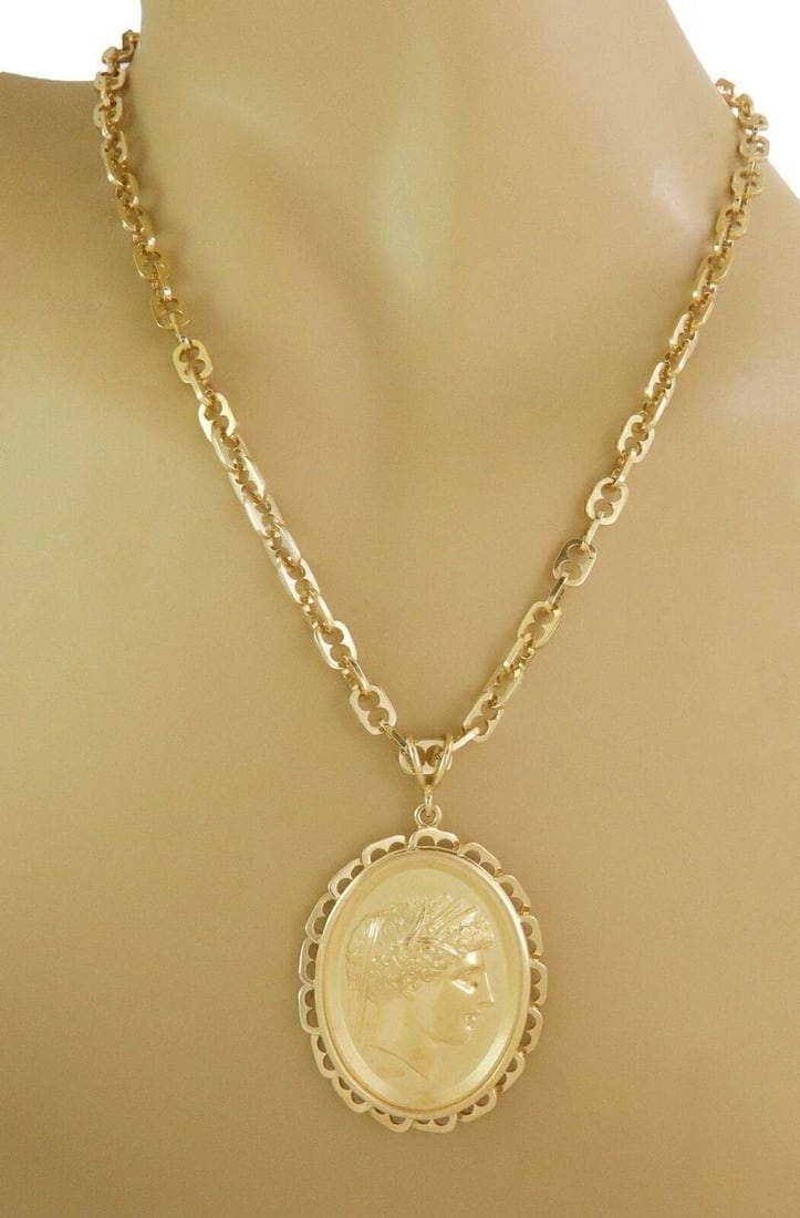 18k Yellow Gold Oval Woman Cameo Pendant Necklace Signed by Wachler 26 Inch: 18k Yellow Gold Oval Woman Cameo Pendant Necklace Signed by Wachler 26 Inch This vintage necklace features a signed Wachler oval pendant with an embossed woman cameo design, crafted in 18k yellow gold