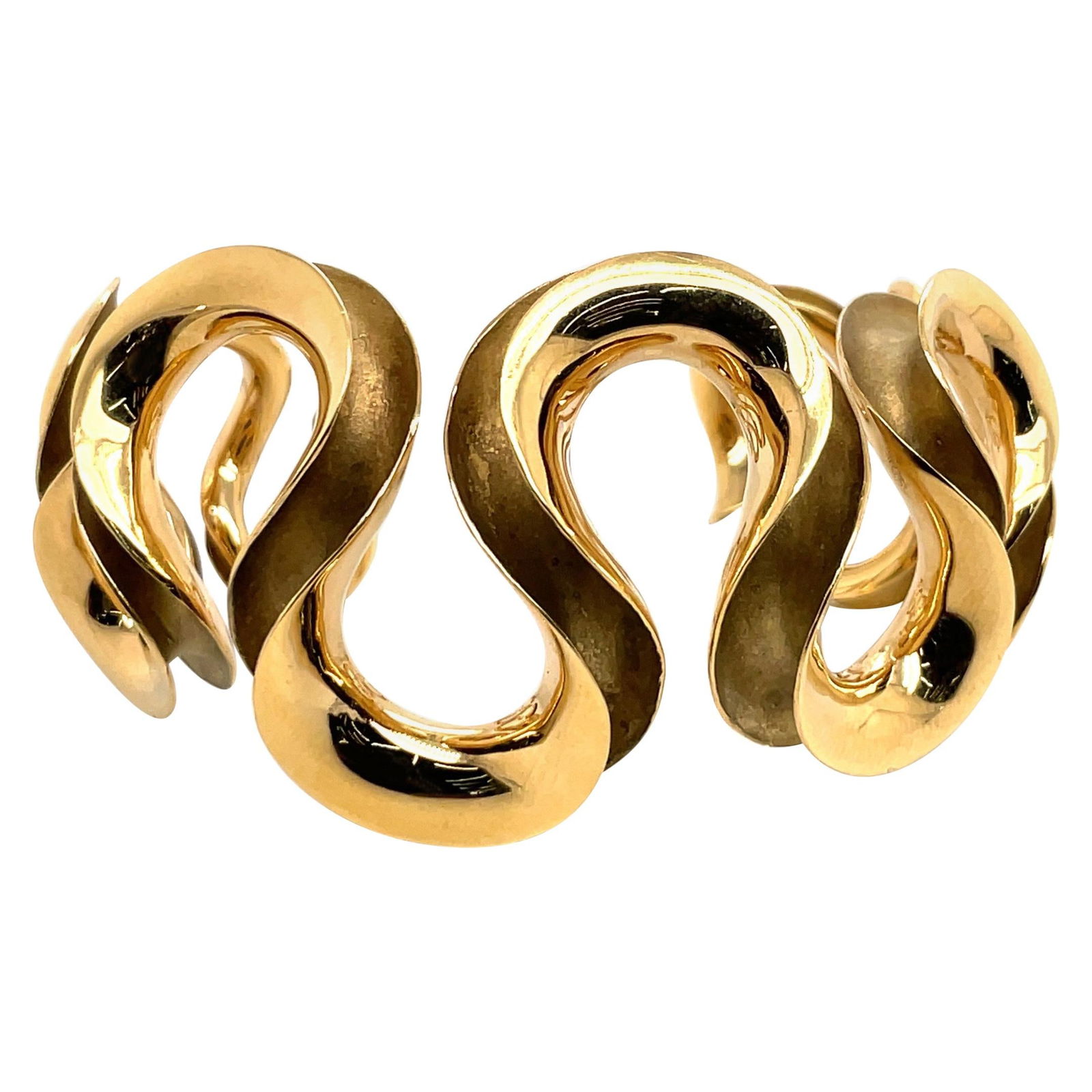 Contemporary 18k Yellow Gold Swirl Motif Cuff Bangle 47.6g: Contemporary 18k Yellow Gold Swirl Motif Cuff Bangle 47.6g This striking 18 Karat Yellow Gold Swirl Cuff Bangle showcases a contemporary design complemented by a unique swirl motif. Weighing 47.6 gram