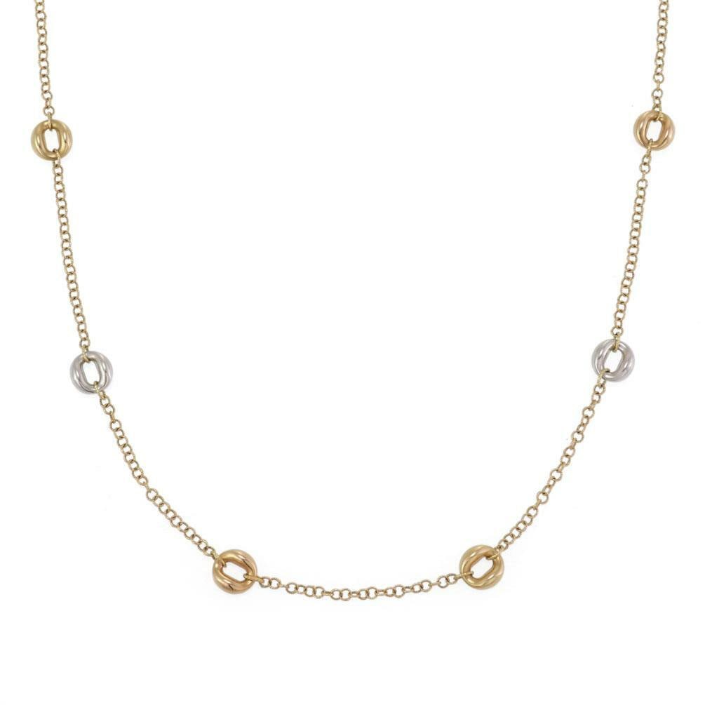 Roberto Coin 18k Two Tone Gold 35 Inch 'O' Motifs Necklace: Roberto Coin 18k Two Tone Gold 35 Inch 'O' Motifs Necklace Elevate your jewelry collection with this exquisite Roberto Coin necklace, crafted from luxurious 18k yellow and white gold. The elegant desi
