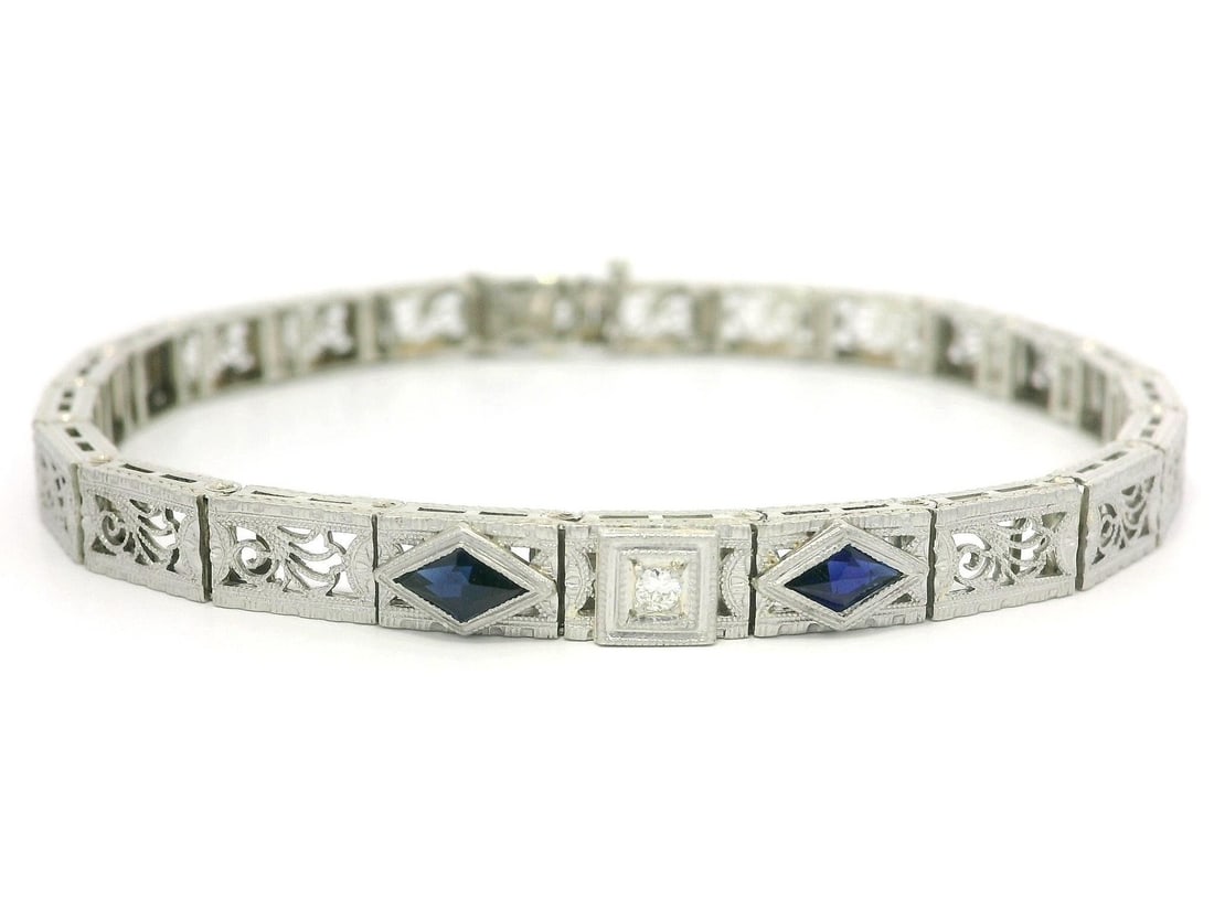 Antique Art Deco 14k Gold Platinum Floral Filigree Bracelet with Sapphire Diamond: Antique Art Deco 14k Gold Platinum Floral Filigree Bracelet with Sapphire Diamond This exquisite Antique Art Deco bracelet showcases a stunning floral filigree design, expertly crafted from solid 14k