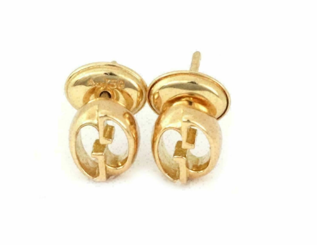 18k Yellow Gold Oval Stud Earrings Gucci G Logo Design: 18k Yellow Gold Oval Stud Earrings Gucci G Logo Design These Gucci G Logo oval stud earrings feature a signature Gucci design in an elegant oval shape. Crafted from 18k yellow gold, they are hallmarke
