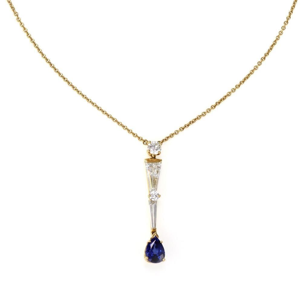 Mikimoto 18k Gold Diamond Sapphire Pendant Necklace with Chain: Mikimoto 18k Gold Diamond Sapphire Pendant Necklace with Chain Exquisite Mikimoto pendant and chain featuring a stunning design in 18k yellow gold. The pendant showcases a long, elegant shape adorned