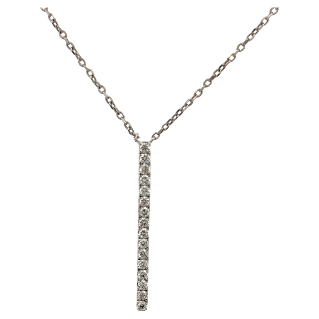 0.40 Carat Diamond Vertical Bar Pendant in 14K White Gold Necklace: 0.40 Carat Diamond Vertical Bar Pendant in 14K White Gold Necklace This contemporary pendant necklace features a sleek vertical bar design crafted in polished 14K white gold. The pendant is set with 1