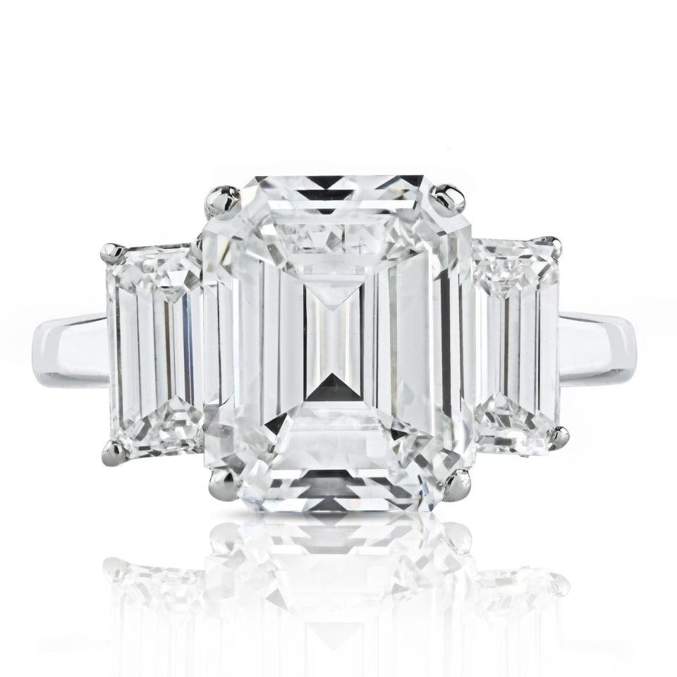 3.20 Carat GIA Certified Emerald Cut Diamond Three Stone Ring in Platinum: 3.20 Carat GIA Certified Emerald Cut Diamond Three Stone Ring in Platinum Experience the timeless elegance of this exquisite 3.20-carat Emerald Cut Diamond F/VS1 Three Stone Engagement Ring. Meticulou