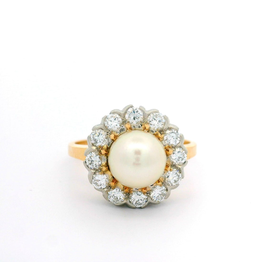 Vintage 14k Yellow Gold Cultured Pearl and Diamond Halo Cocktail Ring: Vintage 14k Yellow Gold Cultured Pearl and Diamond Halo Cocktail Ring This exquisite vintage cocktail ring showcases a stunning 14k yellow gold setting, featuring a genuine cultured pearl at its cente
