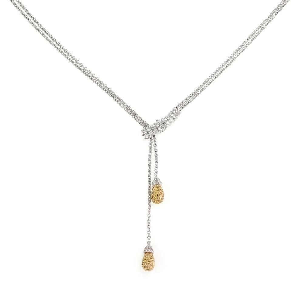 Lariat Necklace in 18k Yellow and White Gold with Yellow and White Diamonds: Lariat Necklace in 18k Yellow and White Gold with Yellow and White Diamonds This modern lariat necklace is crafted from 18k yellow and white gold and features a double strand classic link white gold c