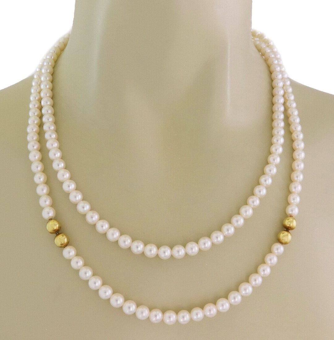 Detachable Mikimoto Pearl Necklace in 18k Yellow Gold Convertible Single Double Strand: Detachable Mikimoto Pearl Necklace in 18k Yellow Gold Convertible Single Double Strand This vintage Mikimoto necklace features high-quality pearls and 18k yellow gold in a versatile design. The neckla