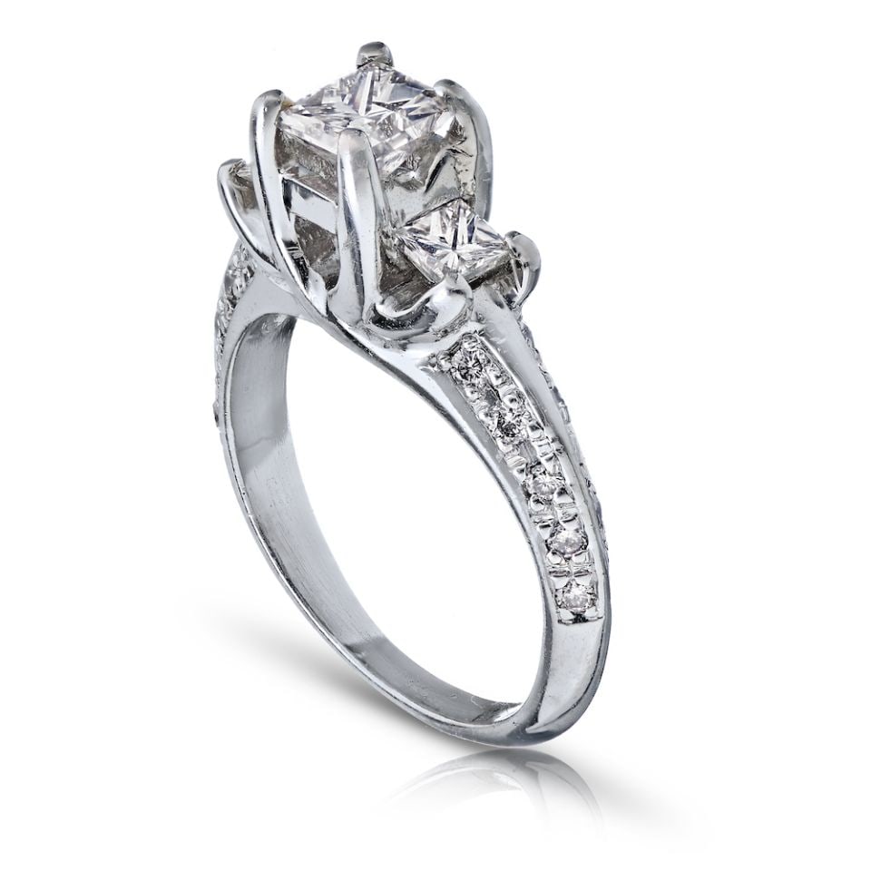 Platinum Three Stone Ring with Princess Cut Diamonds: Platinum Three Stone Ring with Princess Cut Diamonds This exquisite Platinum Princess Cut Diamond Three Stone Ring features a stunning design that highlights three brilliant diamonds, elegantly set in