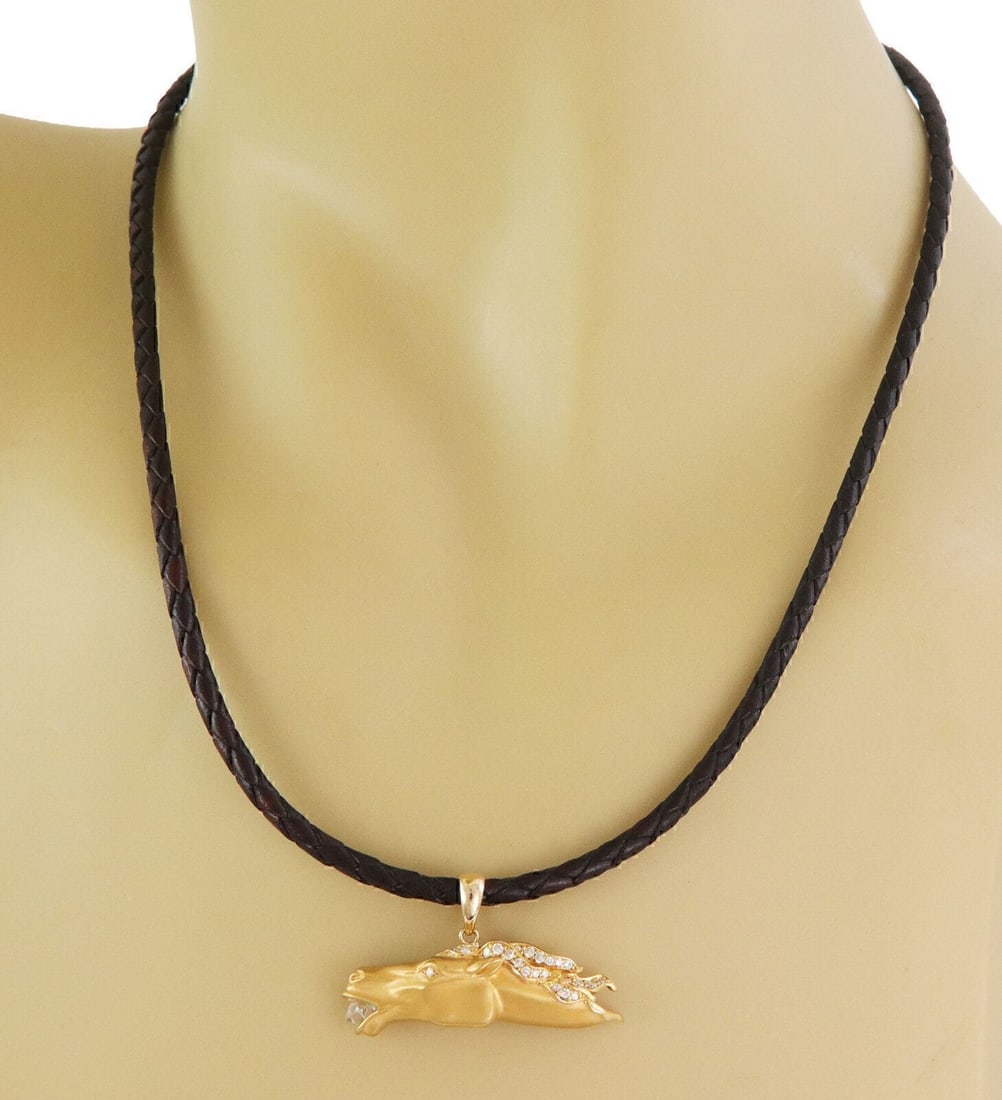 Diamond Horse Pendant Necklace in 18k Yellow Gold on Woven Cord by Carrera y Carrera: Diamond Horse Pendant Necklace in 18k Yellow Gold on Woven Cord by Carrera y Carrera This Carrera y Carrera necklace features a sculptural horse pendant crafted in solid 18k yellow gold, accented with