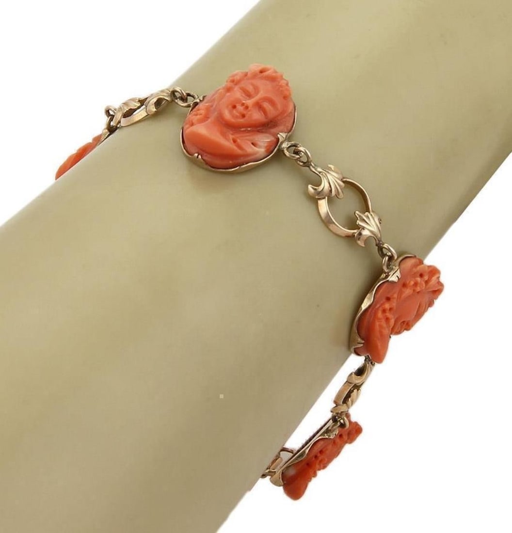 Antique 14k Rose Gold Bracelet with Carved Coral Cameo Woman Busts: Antique 14k Rose Gold Bracelet with Carved Coral Cameo Woman Busts This antique link bracelet is crafted in 14k rose gold and features five high-relief coral cameos, each intricately carved to depict