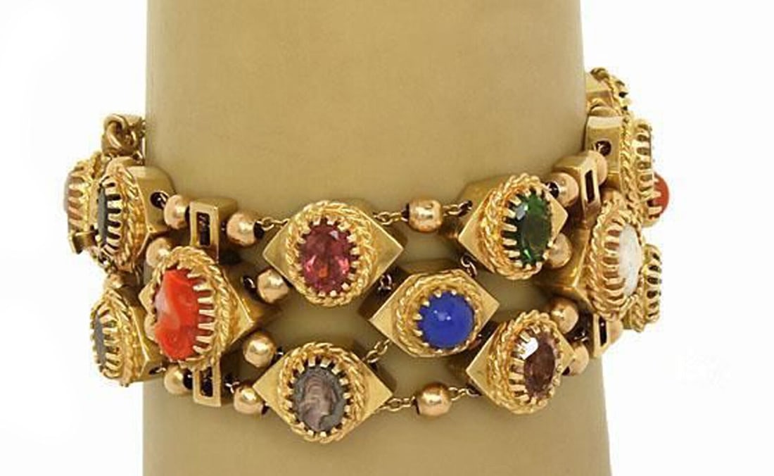 Vintage 14k Gold Bracelet with Multicolor Gemstones and Shell Cameo Charms: Vintage 14k Gold Bracelet with Multicolor Gemstones and Shell Cameo Charms This vintage charm slide bracelet is crafted from solid 14k yellow gold and features a collection of colorful gemstones and h