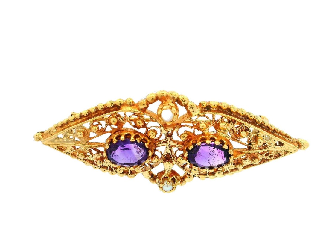 Vintage 13k Yellow Gold Amethyst Seed Pearl Brooch Pin: Vintage 13k Yellow Gold Amethyst Seed Pearl Brooch Pin This exquisite vintage brooch showcases a beautiful oval design crafted in solid 13k-14k yellow gold. It features two natural genuine amethysts,