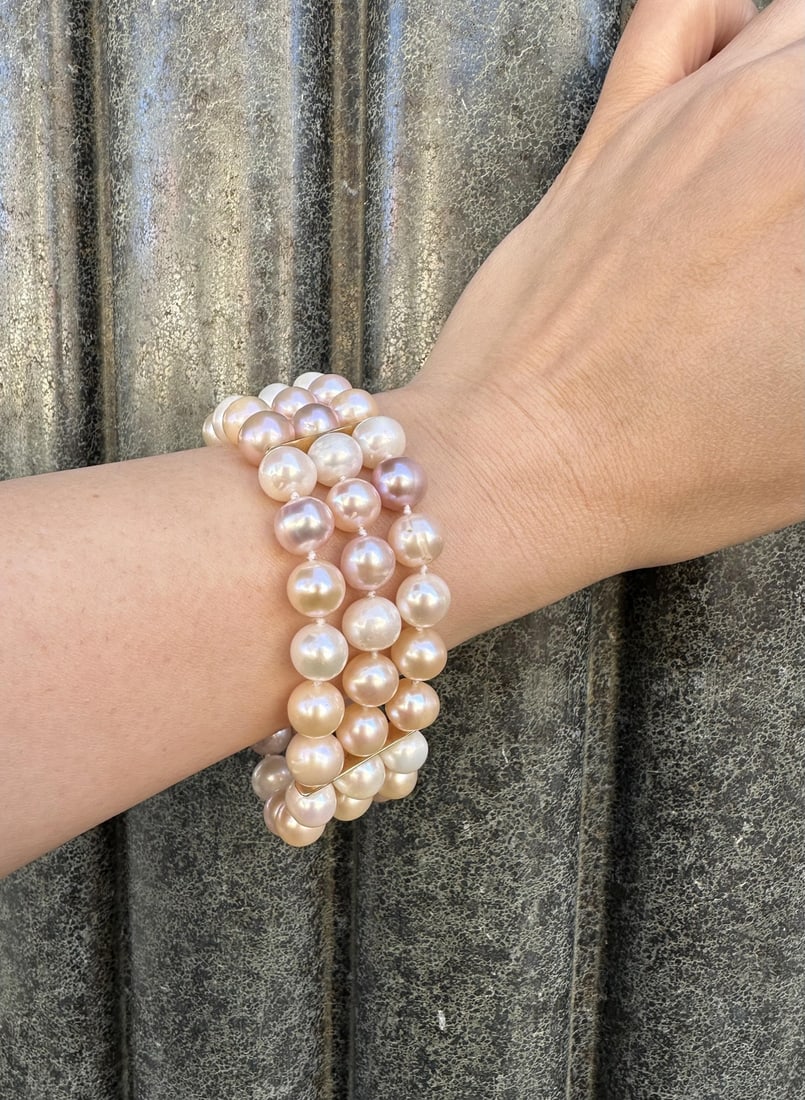 3 Strand Pink Cultured Pearl Bracelet with Diamond 14k Gold Clasp: 3 Strand Pink Cultured Pearl Bracelet with Diamond 14k Gold Clasp This exquisite 3 Strand Cultured Pearl Bracelet features a stunning combination of genuine cultured pearls and diamonds, making it a