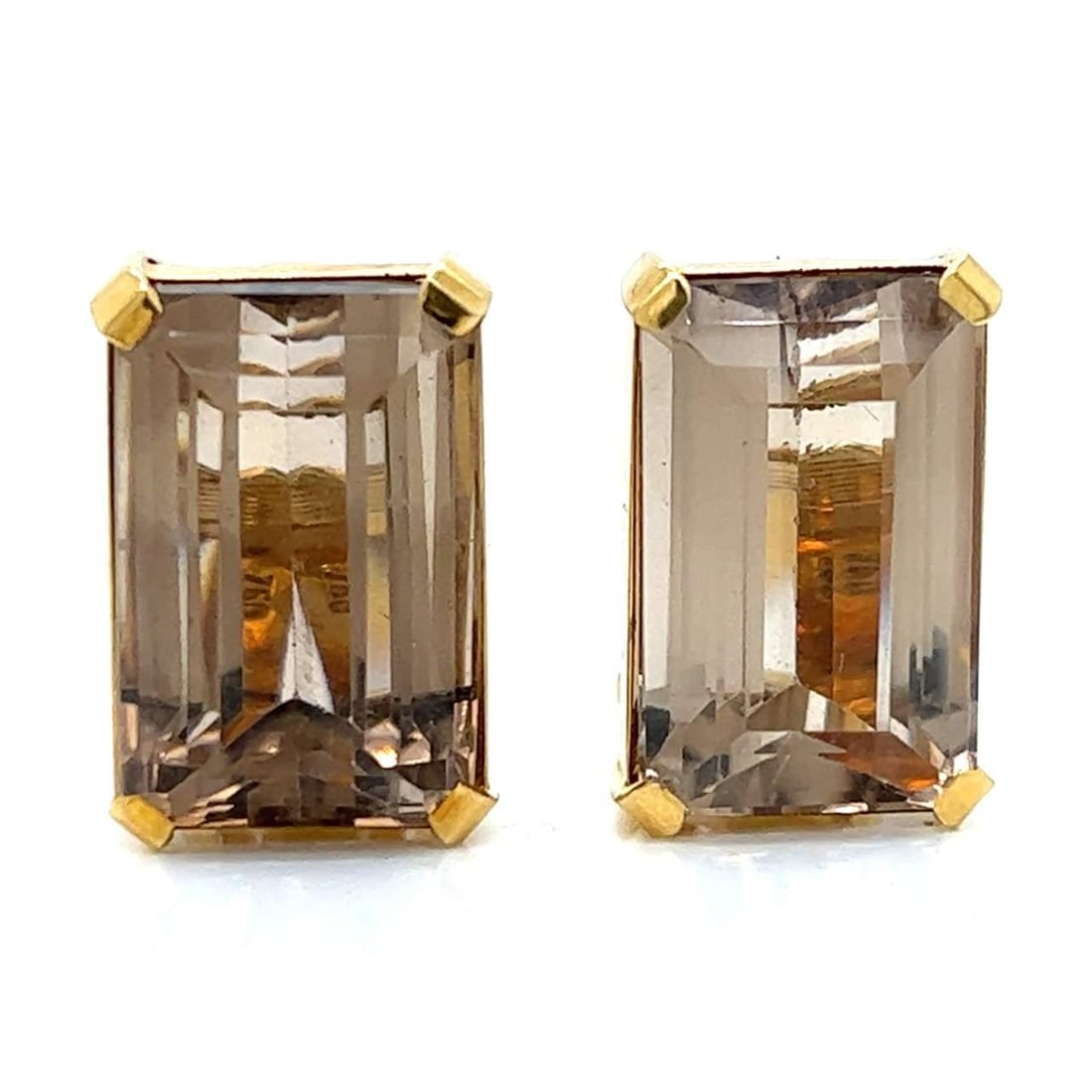 1960's 18K Yellow Gold Earrings with 45 Ct Topaz: 1960's 18K Yellow Gold Earrings with 45 Ct Topaz These exquisite 1960's earrings are crafted from 18K yellow gold, showcasing a stunning design set with two topaz stones that weigh approximately 45.00