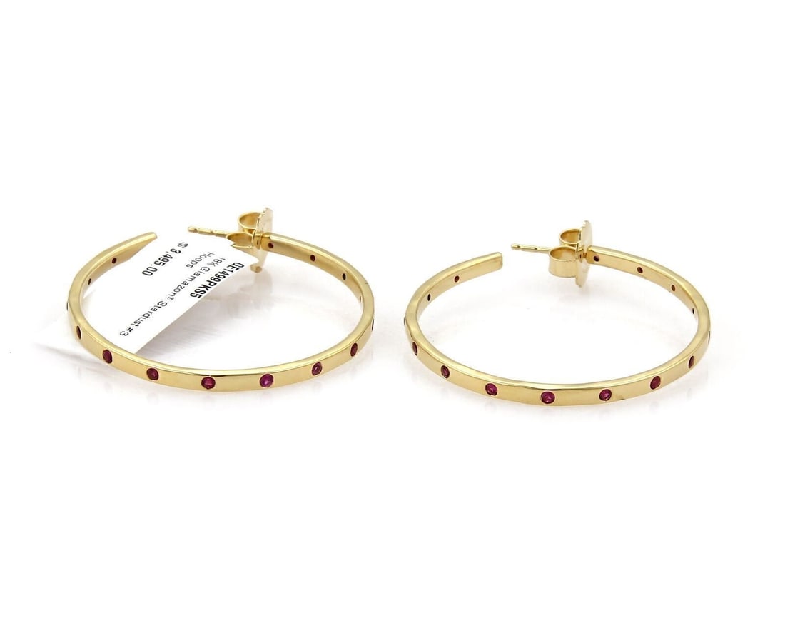Glamazon Stardust 18k Gold Hoop Earrings with Deep Pink Sapphires: Glamazon Stardust 18k Gold Hoop Earrings with Deep Pink Sapphires These Ippolita Glamazon Stardust hoop earrings feature deep pink sapphire stones set in 18k yellow gold. Signed by Ippolita, the earri