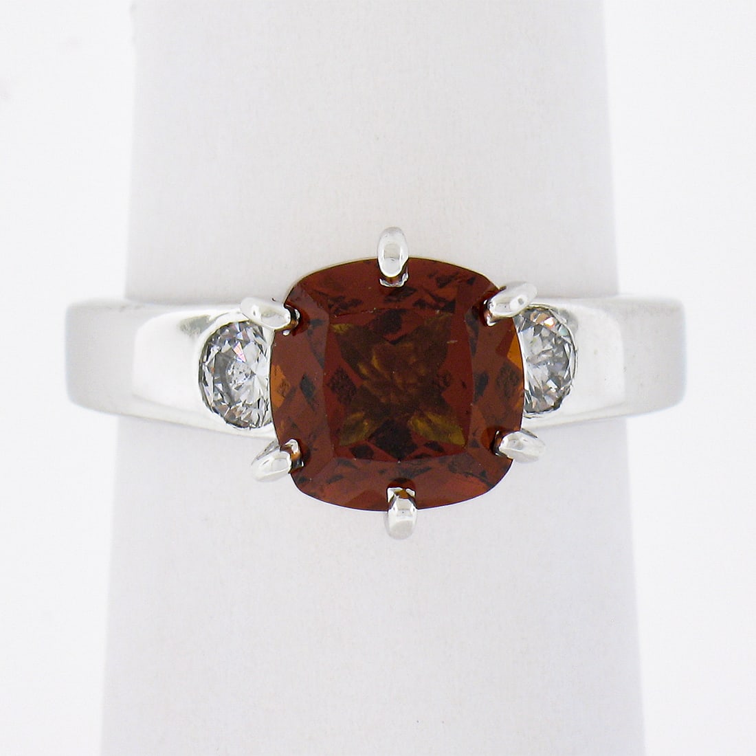 14K White Gold Cushion Citrine & 0.40ctw Diamond Solitaire Cocktail Ring: 14K White Gold Cushion Citrine & 0.40ctw Diamond Solitaire Cocktail Ring This exquisite cocktail ring features a stunning cushion-cut citrine, showcasing a deep orange hue, prominently set in solid 14