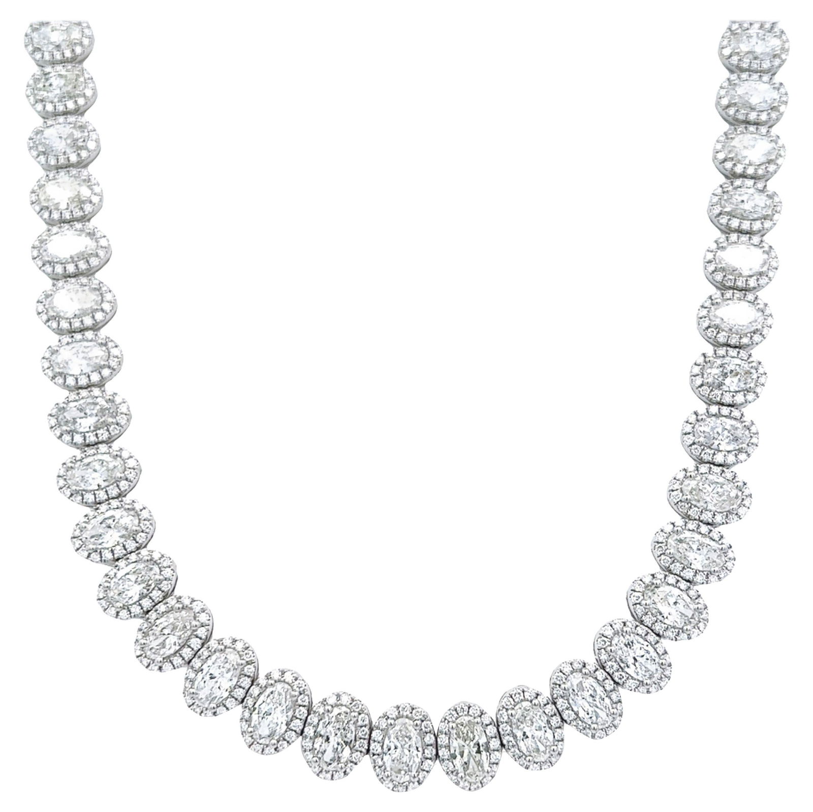 24.22ct Oval Diamond Tennis Necklace 18k White Gold: 24.22ct Oval Diamond Tennis Necklace 18k White Gold This exquisite 24.22ct Oval Diamond Tennis Necklace features a stunning halo design, crafted from 18k white gold. It showcases a total of 60 oval di