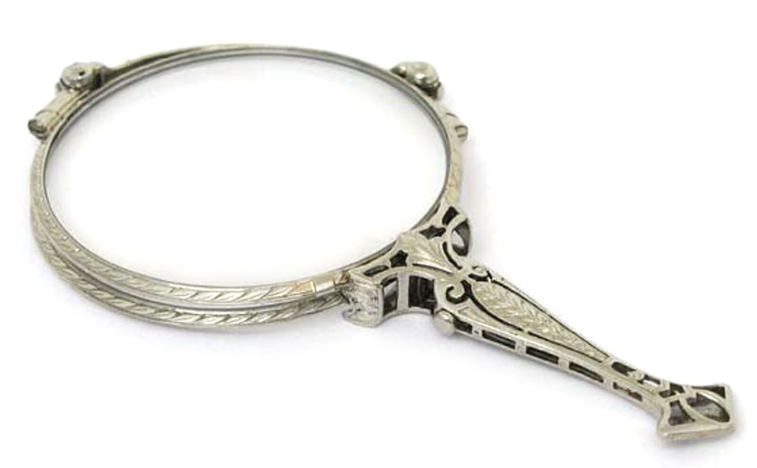 Platinum Art Deco Folding Lorgnette Magnifying Glasses by Tiffany & Co.: Platinum Art Deco Folding Lorgnette Magnifying Glasses by Tiffany & Co. This Art Deco Tiffany & Co. platinum folding lorgnette magnify glasses are an original antique accessory that reflects the fine