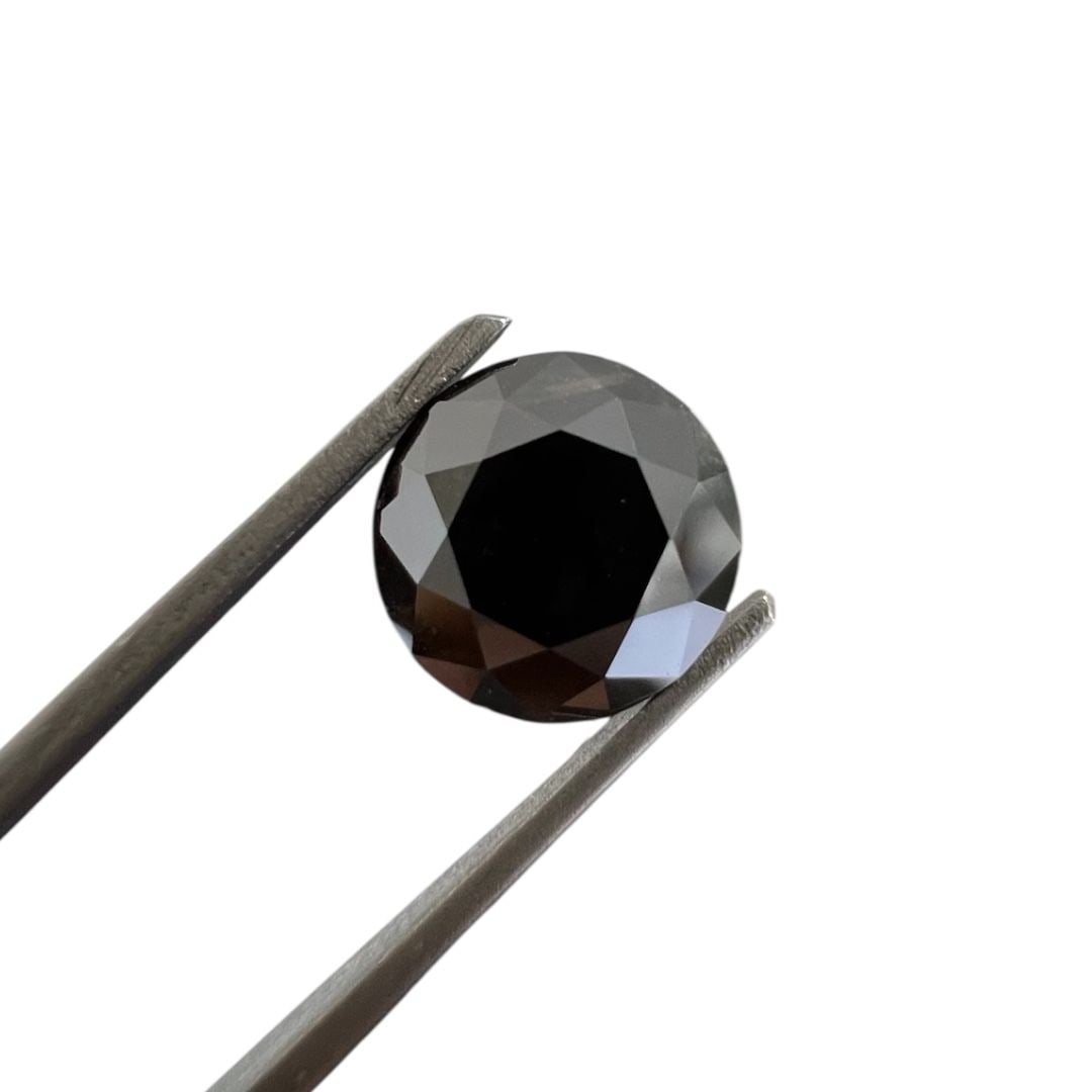 Loose Diamond - ROUND 2.59ct Fancy Black: Loose Diamond - ROUND 2.59ct Fancy Black Source: Natural Shape: ROUND Carats: 2.59 Color: Fancy Black Certification: GIA The Diamond Depot Guarantee: All items in this auction are guaranteed to be 100