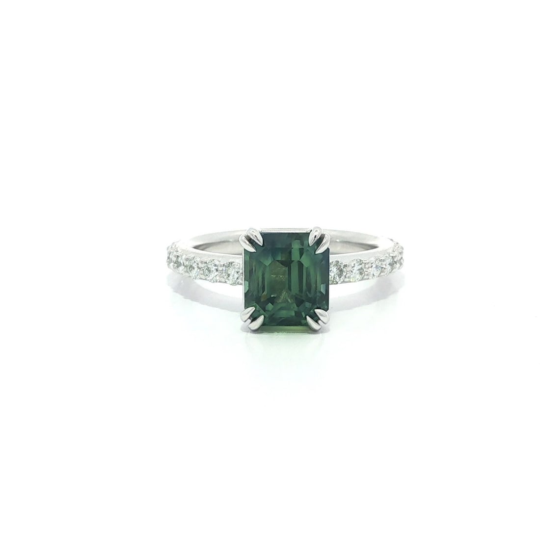 Platinum Band Ring with GIA-Certified No Heat Green Blue Sapphire and Diamonds: Platinum Band Ring with GIA-Certified No Heat Green Blue Sapphire and Diamonds This un-used platinum band ring features a natural, no-heat green-blue sapphire weighing 3.35 carats, highlighted by 20 n