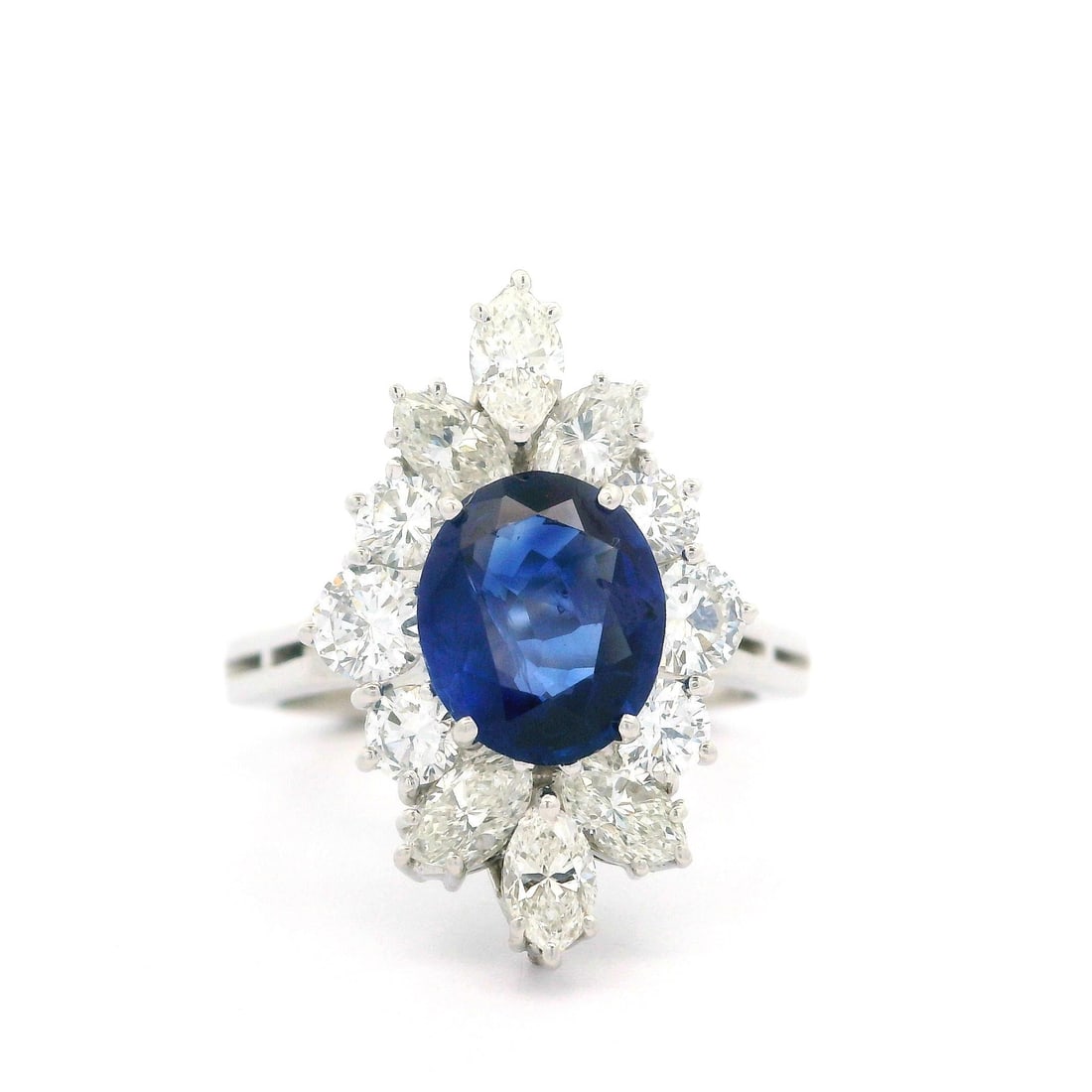 Vintage Platinum GIA Certified 2.4ctw Royal Blue Sapphire Diamond Ring: Vintage Platinum GIA Certified 2.4ctw Royal Blue Sapphire Diamond Ring This exquisite vintage cocktail ring showcases a stunning 1.80ct natural royal blue sapphire, expertly cut in an oval shape and p