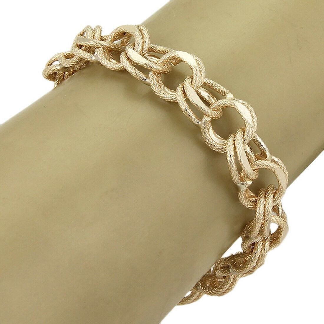 Vintage 14k Yellow Gold Double Round Link Bracelet 12mm Wide 7.5 Inch: Vintage 14k Yellow Gold Double Round Link Bracelet 12mm Wide 7.5 Inch This vintage bracelet features a textured double round link design, expertly crafted from solid 14k yellow gold. Measuring 7.5 inc