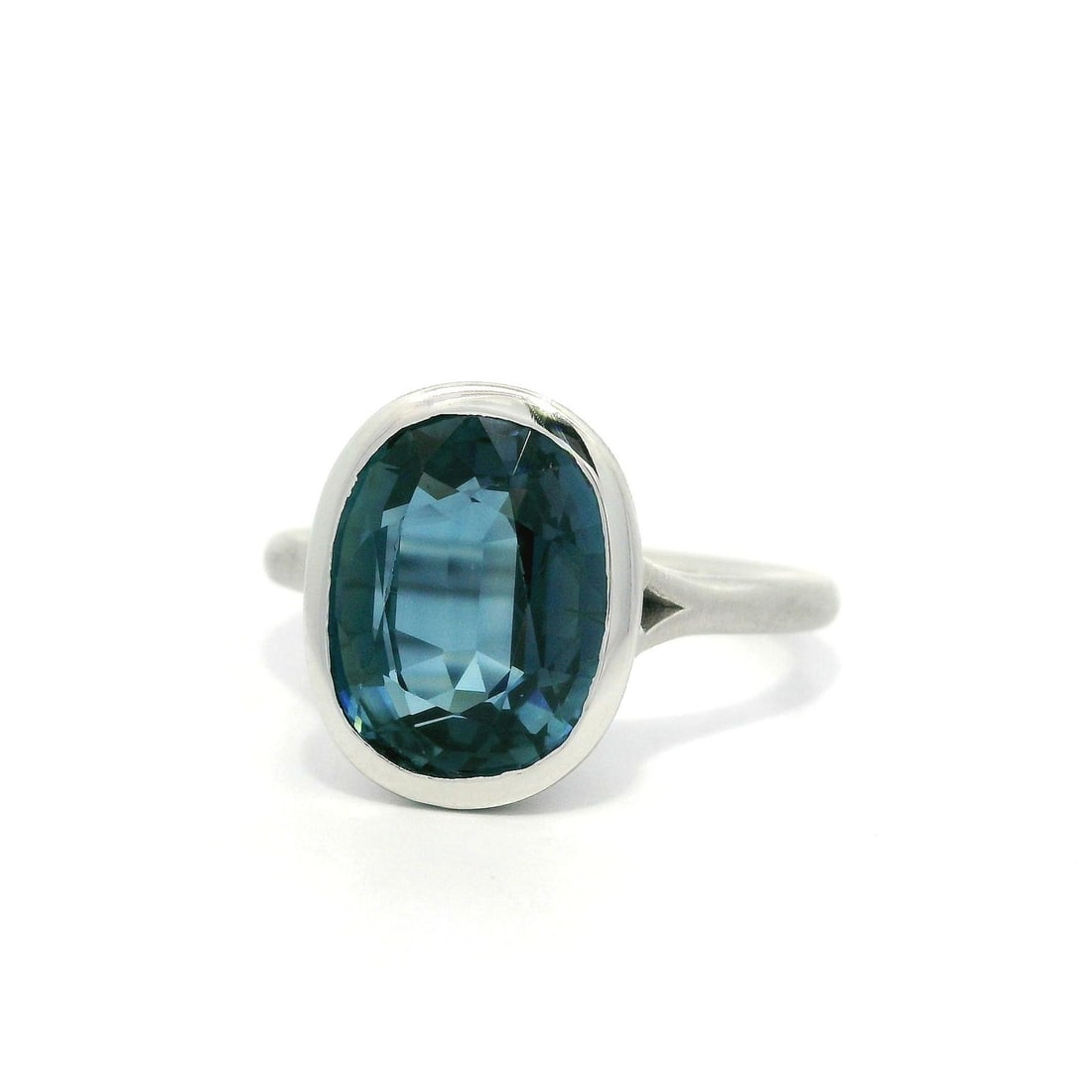 Platinum GIA Certified 5.05ct Blue Sapphire Oval Bezel Ring: Platinum GIA Certified 5.05ct Blue Sapphire Oval Bezel Ring Presenting a stunning Platinum GIA 5.05ct Cushion Oval Bezel Sapphire Solitaire Low Brushed Ring, featuring a natural blue sapphire that