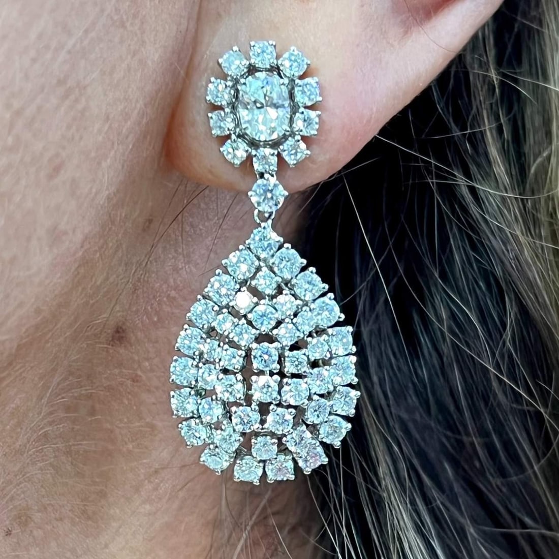 18K White Gold 112 Diamond Drop Earrings F-G VVS-VS 1.5 Inch: 18K White Gold 112 Diamond Drop Earrings F-G VVS-VS 1.5 Inch Elevate your elegance with these stunning 18K White Gold Diamond Drop Earrings. Weighing 14.3 grams, these earrings feature a total of 112