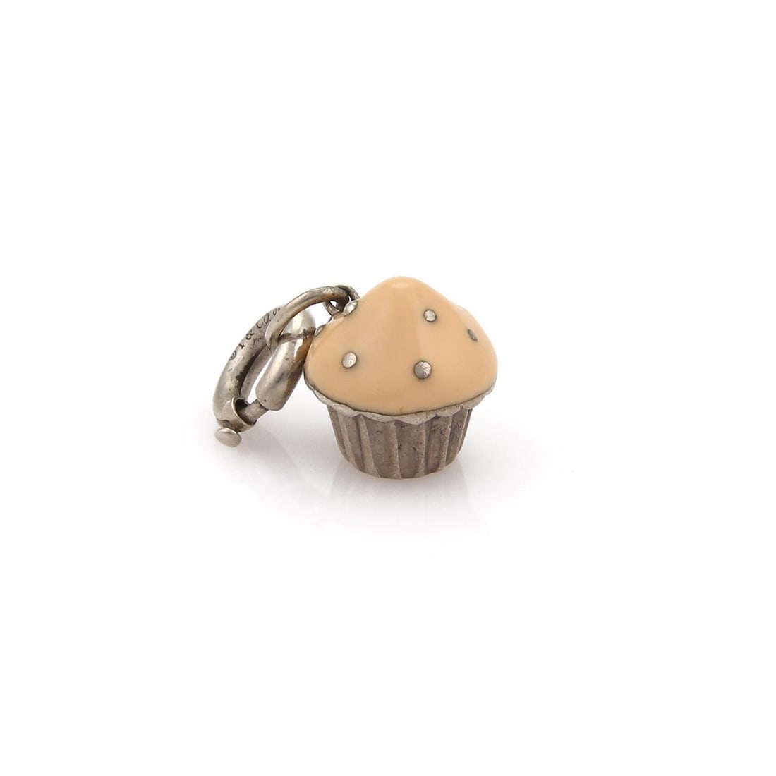 Tiffany & Co. Sterling Silver Cup Cake Charm with Peach Enamel: Tiffany & Co. Sterling Silver Cup Cake Charm with Peach Enamel Delight in this charming vintage Cup Cake Charm from Tiffany & Co. Crafted in high-quality sterling silver, this whimsical piece