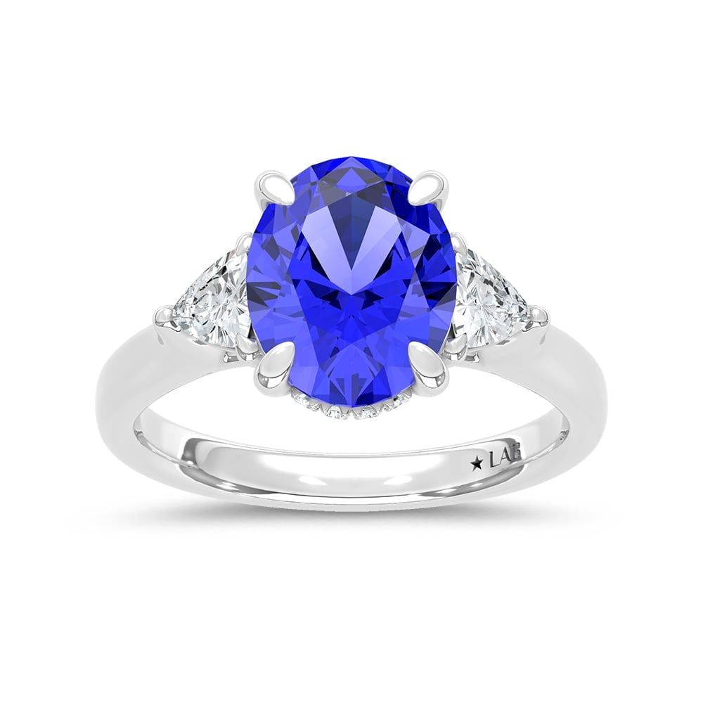 14K White Gold Lab Grown Diamond 4 1/5 Ct.Tw. Oval Shape Recrystalized Blue Sapphire Engagement Ring: 14K White Gold Lab Grown Diamond 4 1/5 Ct.Tw. Oval Shape Recrystalized Blue Sapphire Engagement Ring (Center 3 5/8 ct) Radiate elegance with this 14K white gold engagement ring. Its centerpiece is a s