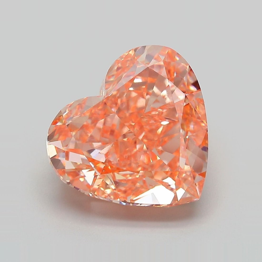 Loose Diamond - HEART 8.04ct Fancy Vivid Pinkish Orange VS1: Loose Diamond - HEART 8.04ct Fancy Vivid Pinkish Orange VS1 Source: This is a real non-mined Diamond that has been grown in a lab Shape: HEART Carats: 8.04 Color: Fancy Vivid Pinkish Orange Certificat