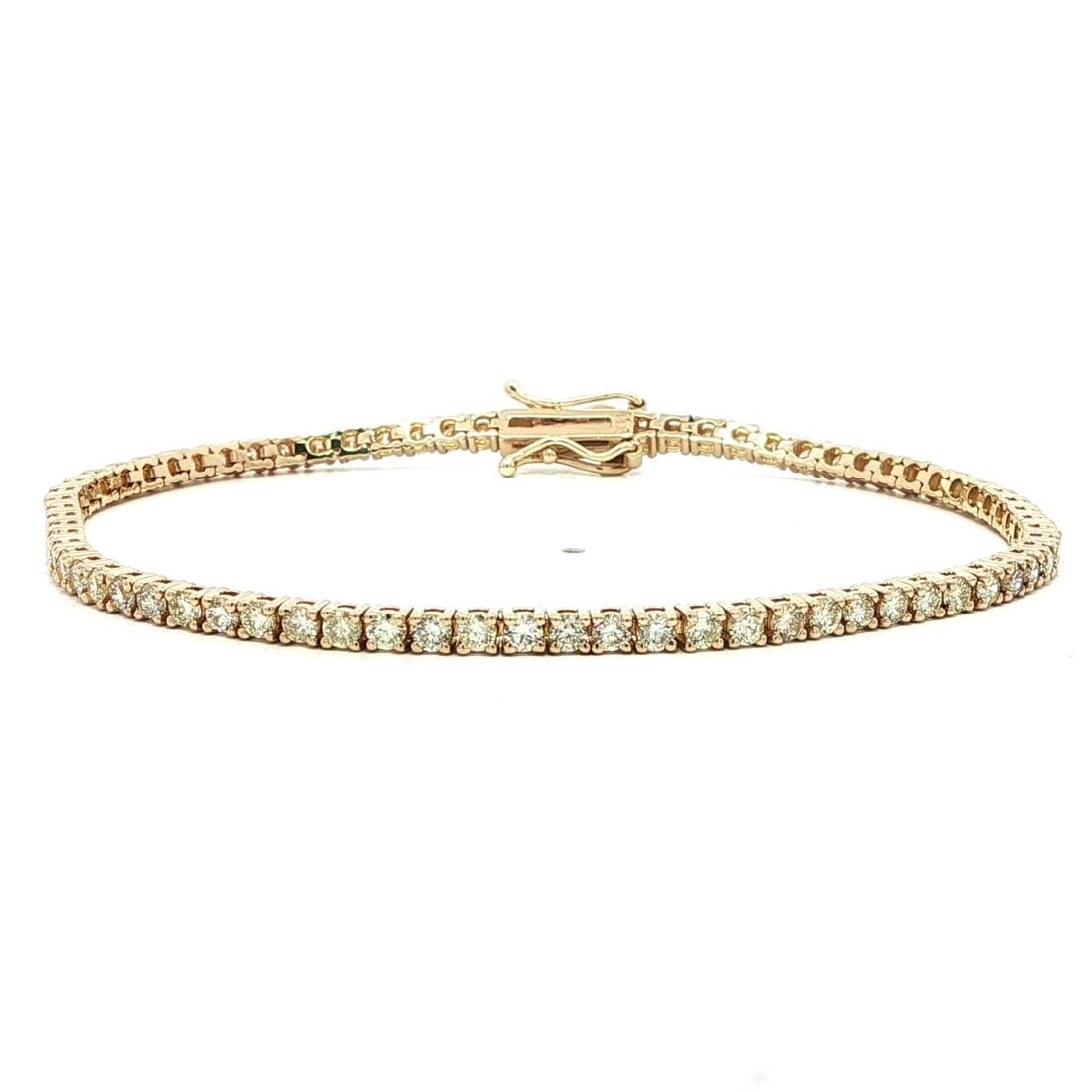 14k Yellow Gold 2.92ctw Diamond Classic Tennis Bracelet: 14k Yellow Gold 2.92ctw Diamond Classic Tennis Bracelet This stunning tennis bracelet features a classic line design crafted from solid 14k yellow gold, showcasing a total of 73 natural round brillian