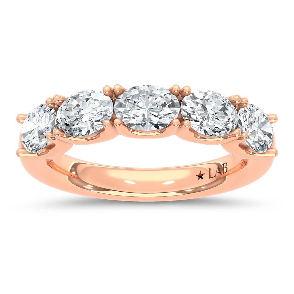 14K Rose Gold Lab Grown Diamond 2 Ct.Tw. Oval Shape East West Wedding Band: 14K Rose Gold Lab Grown Diamond 2 Ct.Tw. Oval Shape East West Wedding Band Make a statement with this unique 14K Rose gold wedding band, featuring 2 carats total weight of lab-grown diamonds set in an