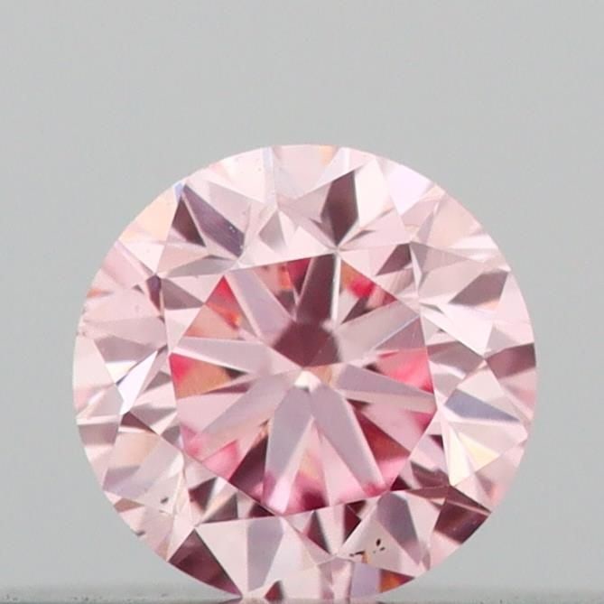 Loose Diamond - ROUND 0.14ct Fancy Vivid Pink VS2: Loose Diamond - ROUND 0.14ct Fancy Vivid Pink VS2 Source: This is a real non-mined Diamond that has been grown in a lab Shape: ROUND Carats: 0.14 Color: Fancy Vivid Pink Certification: IGI Video: