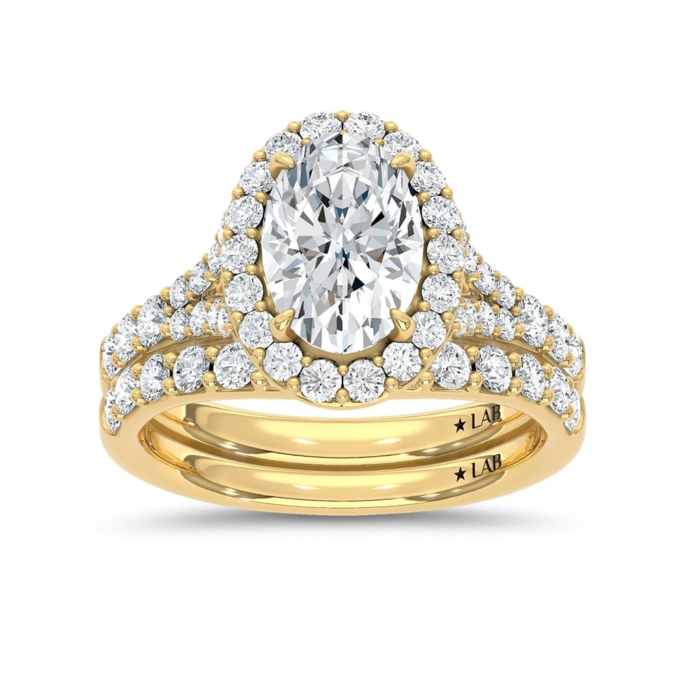 14K Yellow Gold 3 Ct.Tw. Lab Grown Diamond Oval Shape Bridal Ring (IGI Certified Center 2ct Oval): 14K Yellow Gold 3 Ct.Tw. Lab Grown Diamond Oval Shape Bridal Ring (IGI Certified Center 2ct Oval) 14k Yellow Gold Stone Color: D-f Stone Clarity: Vs Each ring is presented in standard size 6.5. Compli