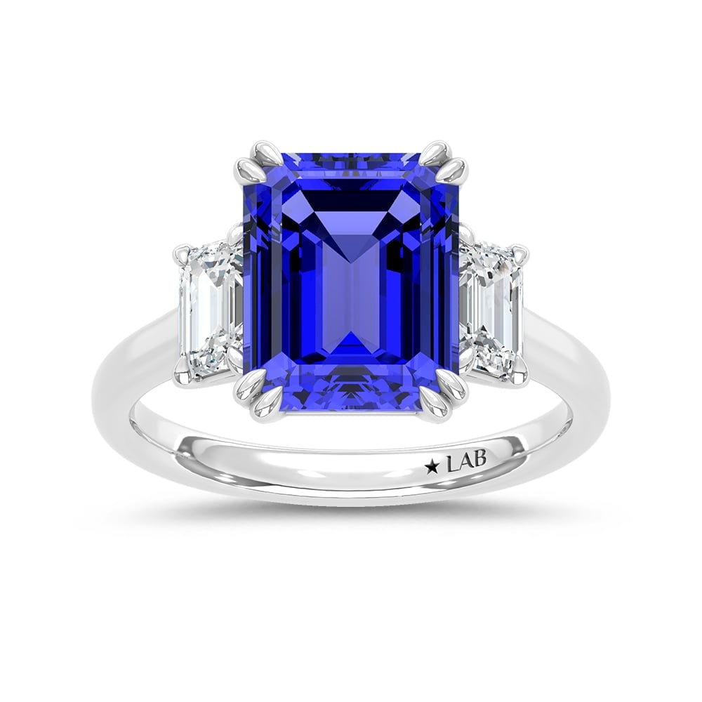 14K White Gold Lab Grown Diamond 5 1/2 Ct.Tw. Emerald Shape Recrystalized Blue Sapphire Engagement: 14K White Gold Lab Grown Diamond 5 1/2 Ct.Tw. Emerald Shape Recrystalized Blue Sapphire Engagement Ring (Center 4 1/2 ct) Make a statement of elegance with this 14K white gold engagement ring. The cen