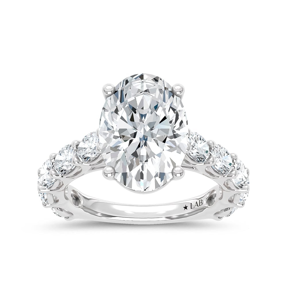 14K White Gold Lab Grown Diamond 7 Ct.Tw. Oval Shape Engagement Ring: 14K White Gold Lab Grown Diamond 7 Ct.Tw. Oval Shape Engagement Ring This elegant diamond engagement ring crafted in 14k White gold, features a Oval -cut center stone of 5 ct that creates a stunning s