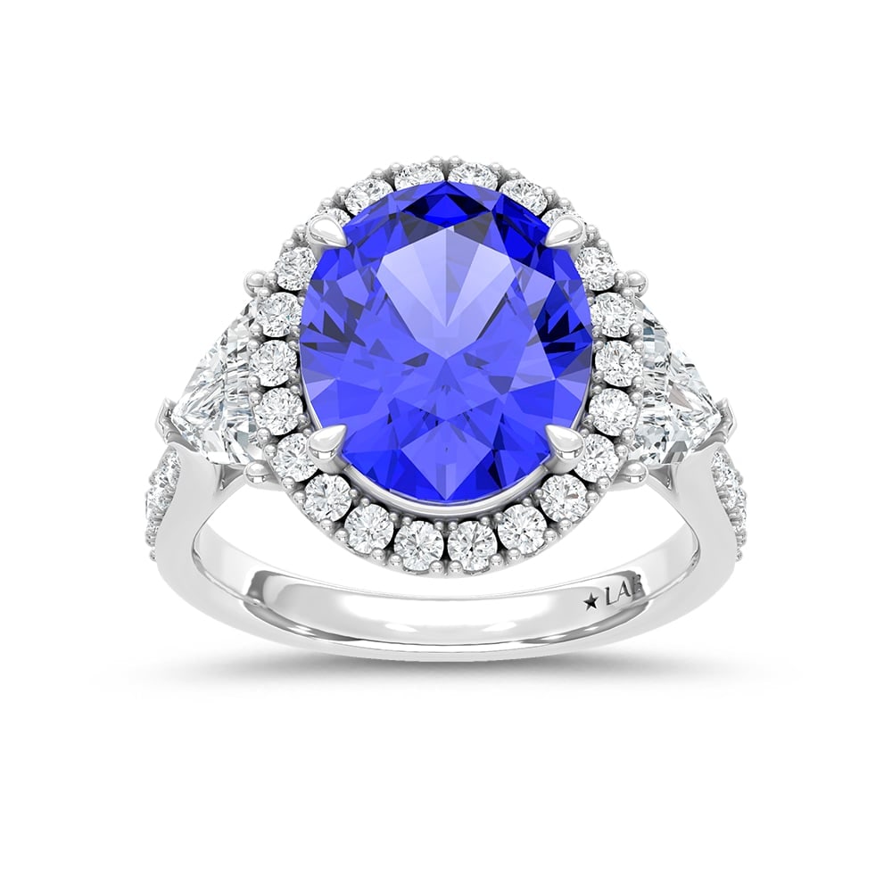 14K White Gold Lab Grown Diamond 8 1/2 Ct.Tw. Oval Shape Recrystalized Blue Sapphire Engagement Ring: 14K White Gold Lab Grown Diamond 8 1/2 Ct.Tw. Oval Shape Recrystalized Blue Sapphire Engagement Ring (Center 6 5/8 ct) Exude sophistication with this 14K white gold engagement ring. Its centerpiece is