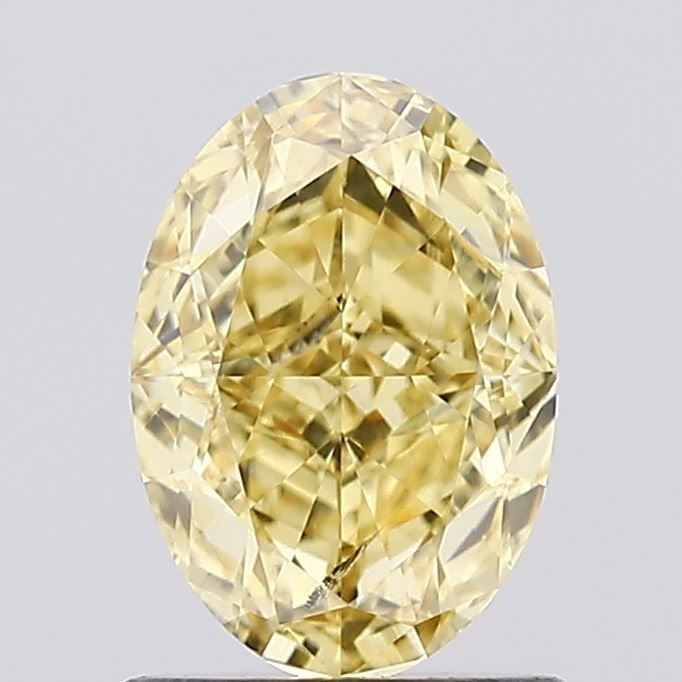 Loose Diamond - OVAL 1.14ct Fancy Vivid Yellow SI1: Loose Diamond - OVAL 1.14ct Fancy Vivid Yellow SI1 Source: This is a real non-mined Diamond that has been grown in a lab Shape: OVAL Carats: 1.14 Color: Fancy Vivid Yellow Certification: IGI Video: