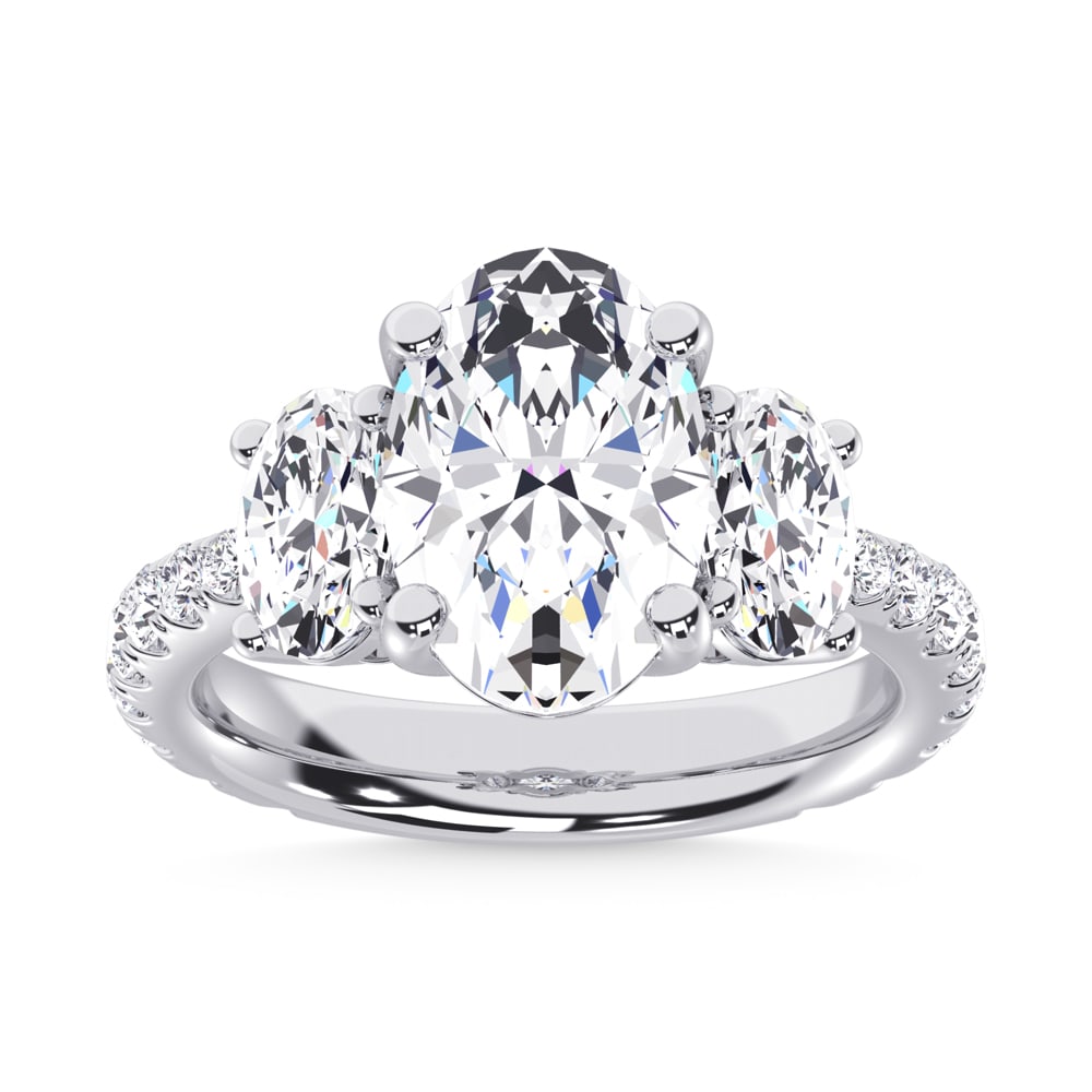 14K White Gold Lab Grown Diamond 5 1/4 Ct.Tw. Oval Shape Three Stone Ring: 14K White Gold Lab Grown Diamond 5 1/4 Ct.Tw. Oval Shape Three Stone Ring This stunning three-stone ring features a sparkling 3 CT Oval Center diamond with two shimmering side diamonds, symbolizing pa
