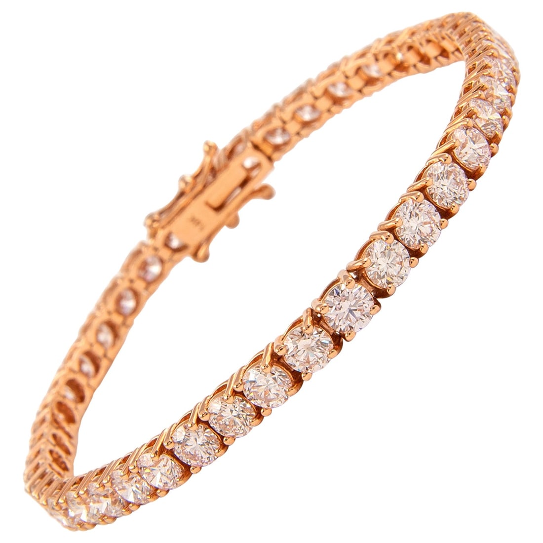 9.92ct Round Cut Diamond Tennis Bracelet in Rose Gold: 9.92ct Round Cut Diamond Tennis Bracelet in Rose Gold This exquisite 9.92ct diamond tennis bracelet features a stunning array of 44 round brilliant diamonds, elegantly set in 14k rose gold. The diamon