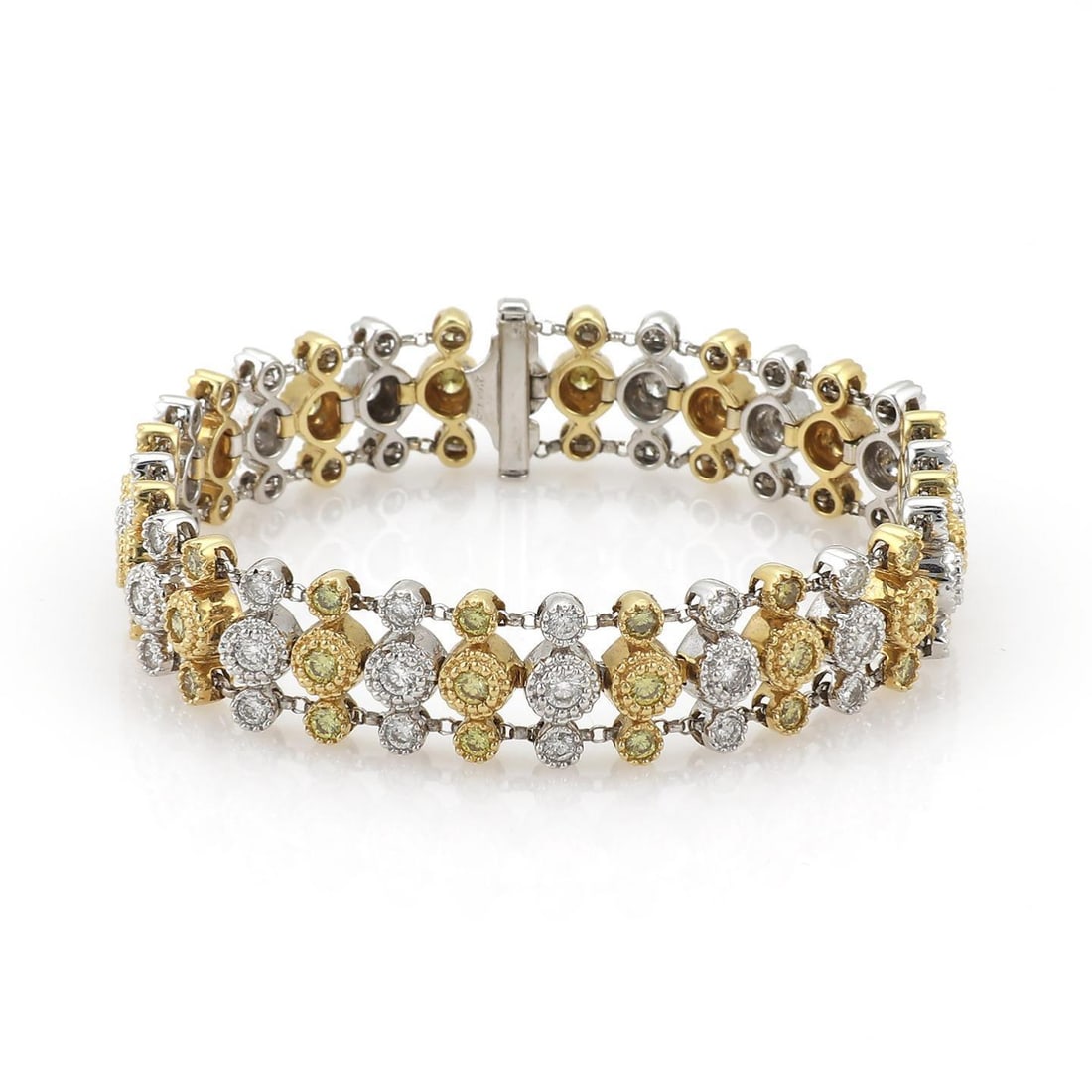 Estate 4ct Fancy Yellow Diamond 18k Gold Triple Row Bracelet: Estate 4ct Fancy Yellow Diamond 18k Gold Triple Row Bracelet This stunning bracelet is meticulously crafted from 18k yellow and white gold, featuring a striking design of triple rows of rosette links.