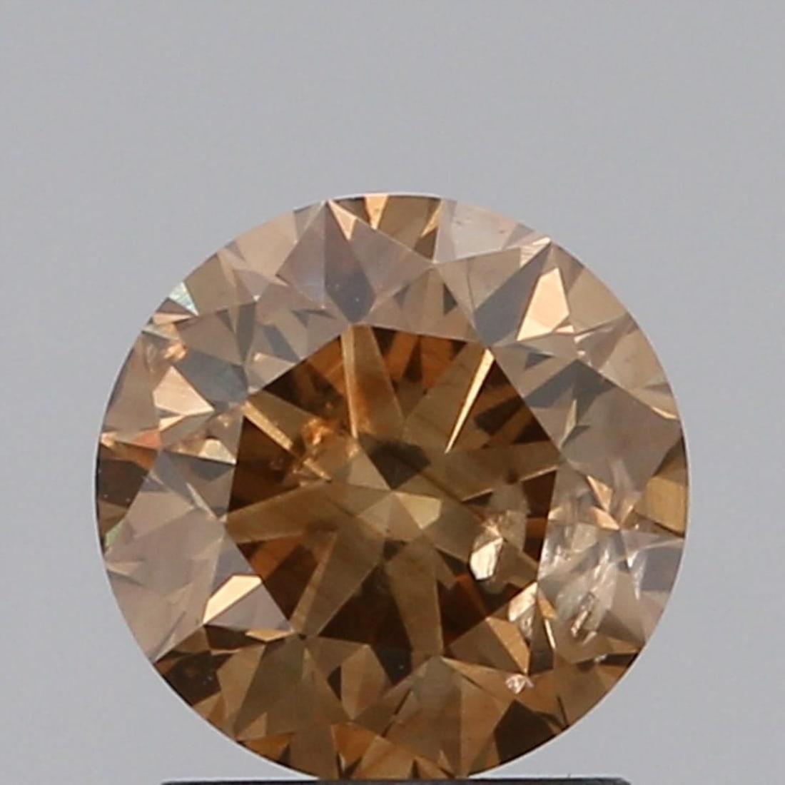 Loose Diamond - ROUND 1.32ct Brown SI2: Loose Diamond - ROUND 1.32ct Brown SI2 Source: Natural Shape: ROUND Carats: 1.32 Color: Brown Certification: NONE Video: