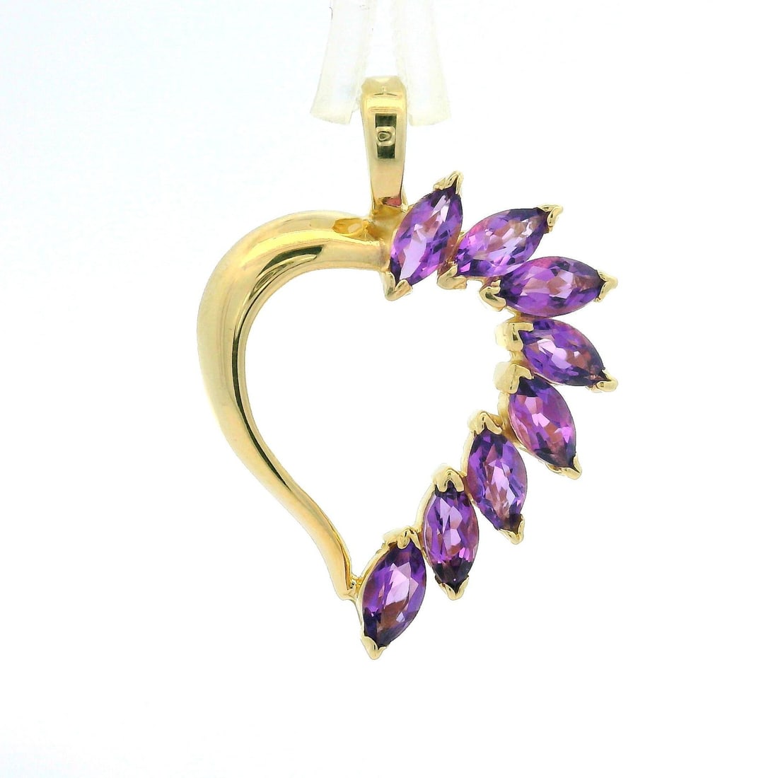 Estate 14k Yellow Gold Amethyst Open Heart Charm Pendant: Estate 14k Yellow Gold Amethyst Open Heart Charm Pendant This exquisite Estate 14k Yellow Gold Marquise Cut Amethyst Spray Open Heart Charm Pendant features a stunning arrangement of eight natural gen