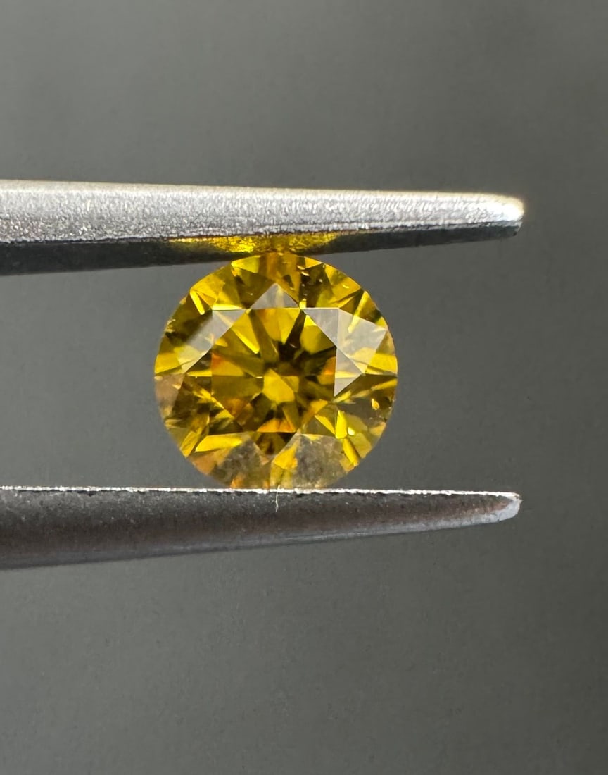 Loose Diamond - ROUND 0.22ct Fancy Vivid Orangey Yellow VS2: Loose Diamond - ROUND 0.22ct Fancy Vivid Orangey Yellow VS2 Source: Natural Shape: ROUND Carats: 0.22 Color: Fancy Vivid Orangey Yellow Certification: GIA The Diamond Depot Guarantee: All items in thi