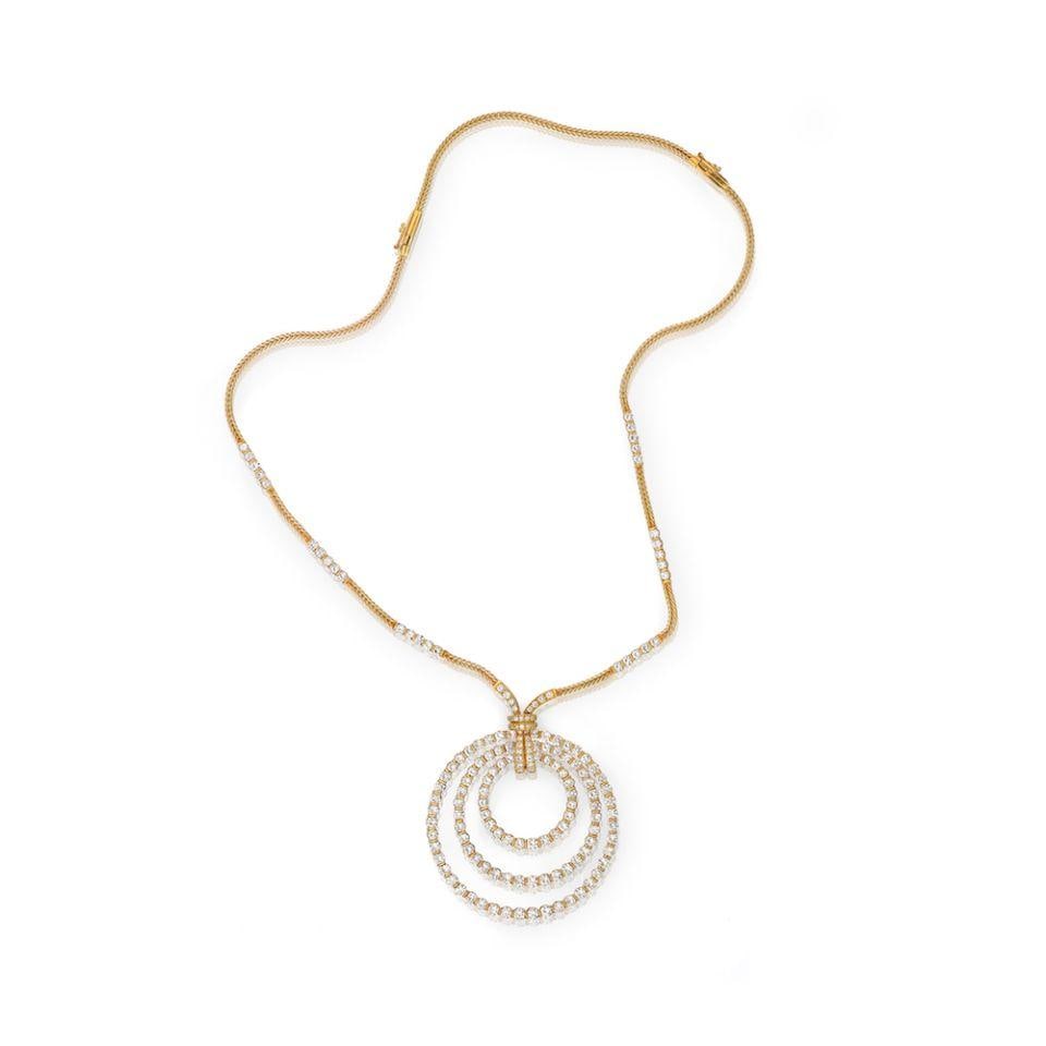 Triple Circle Pendant Necklace in 18K Yellow Gold with 19 Carats Diamonds: Triple Circle Pendant Necklace in 18K Yellow Gold with 19 Carats Diamonds This impressive pendant necklace features a triple circle design, meticulously crafted in 18K yellow gold. The 2.25-inch circu